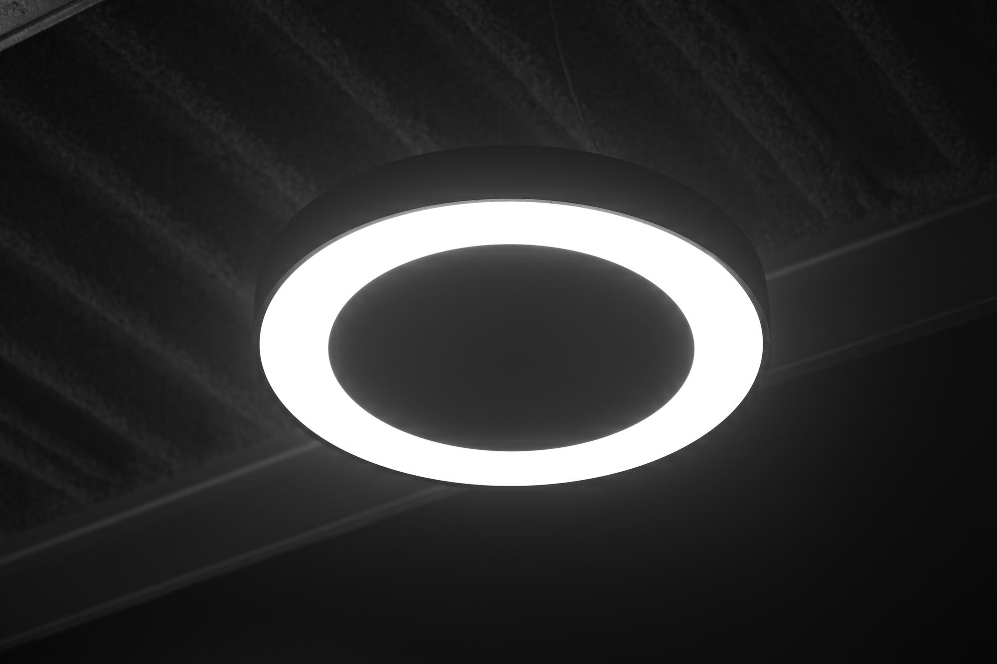 Circular ceiling light in an Acosorb acoustic interior