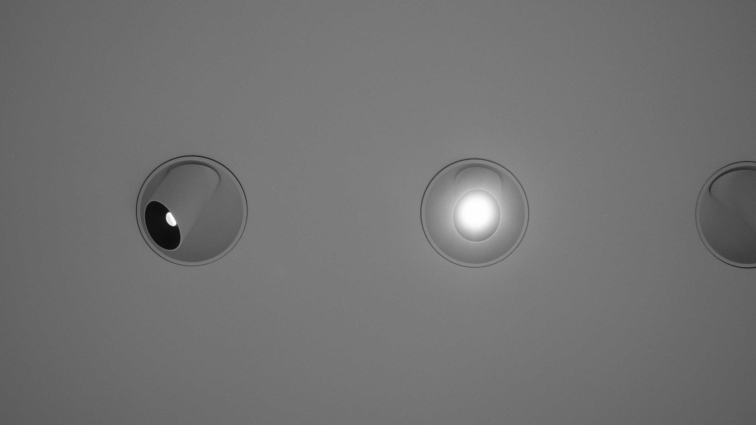 Acoustic ceiling with built-in lamps providing modern design and sound control